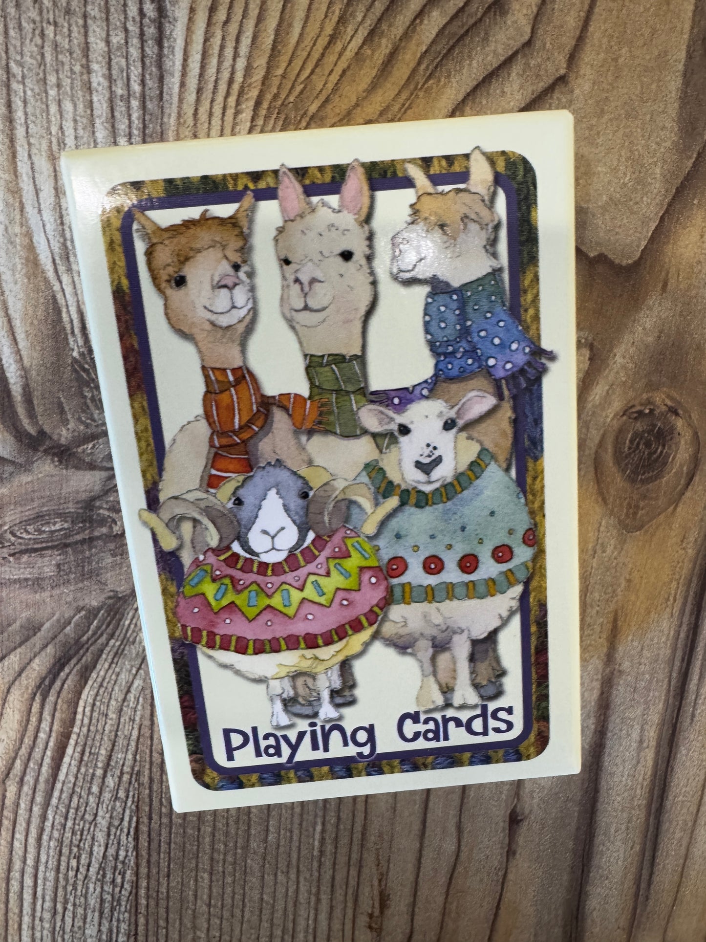 Alpaca and sheep playing cards
